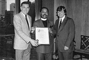 Mayor Raymond L. Flynn presenting award to unidentified man