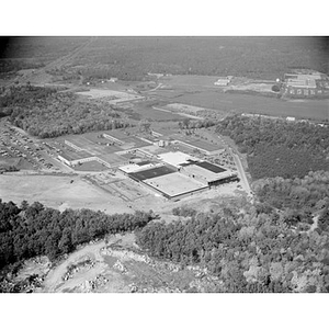 Suburban location of industrial buildings, some new construction, unidentified