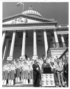 John Joseph Moakley, Fawn Evenson and others on the Capitol steps at a Support of the Textile Act Rally, 1980s