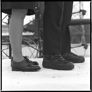 "Big feet  small feet." Picture of feet of male and female RUC officers