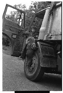 Two children playing at the wheel of a lorry