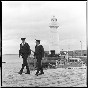 RUC officers on the beat/on patrol at Donaghadee, Co. Down. Lighthouse in background