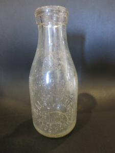 Glass bottle from M. J. Lang Milk Company