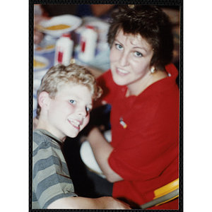 A woman and a boy posing for the camera at a Boys & Girls Club Awards Night