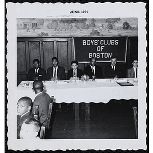 "Boy of the Year," Oswald Gooden seated at the head table with his father and other guests at the award ceremony