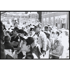 Children and adults standing in lines in front of the carnival games booths at the Boys and Girls Clubs of Boston 100th Anniversary Celebration Street Fair