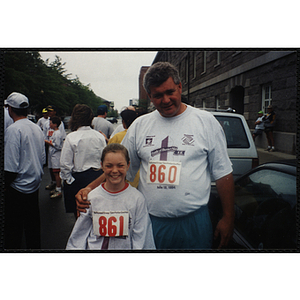 A girl and man pose for a shot during the Battle of Bunker Hill Road Race