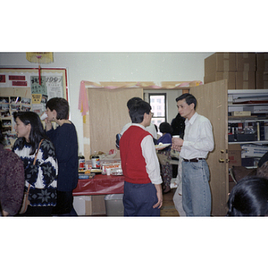 Guests at the Chinese Progressive Association office during a celebration of the Chinese New Year