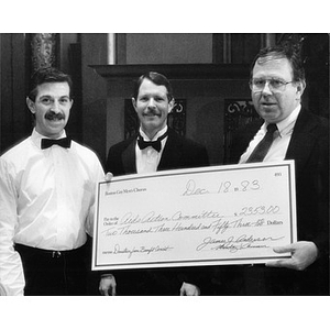 Boston Gay Men's Chorus check presentation to the AIDS Action Committee