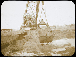 An excavator works on the Cape Cod Canal