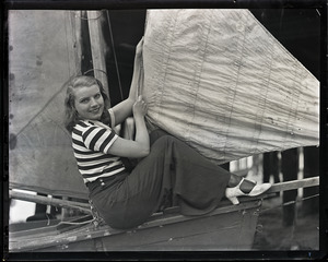 Helen Kaiser, seated aboard a sailboat