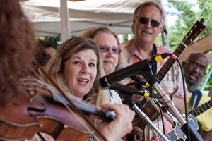 Lisa Gutkin (obscured), Dar Williams, Holly Near, David Amram, Tom Chapin, and Josh White, Jr.(from left) performing on the Rainbow stage at the Clearwater Festival