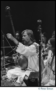 Bhagavan Das on stage with dotara, singing with Amazing Grace, at Zellerbach Hall, U.C. Berkeley