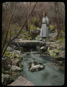 Brook in Weston (Girl on stone bridge over brook looking into water)