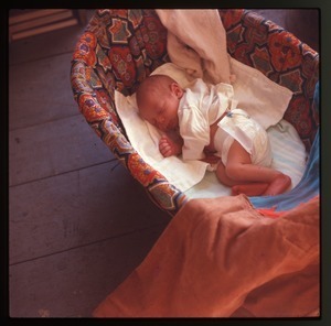 Baby (Eben Light) in a basket, Montague Farm Commune