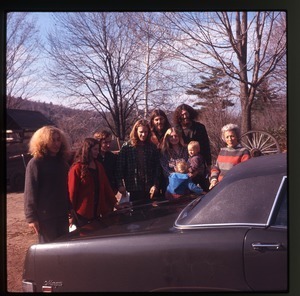 Group of commune members at Montague Farm Commune, including Charles Light and Nina Keller (far left), Janice Frey (with baby), and Tony Mathews (behind Frey's right shoulder)
