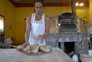 Hungry Ghost Bread: owner and baker Jonathan C. Stevens with fresh-baked bread