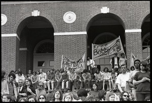 Demonstration at State House against the killings at Kent State: crowd on State House steps holding up banners "Free Bobby" and "Stop war against Indochina & Black America"