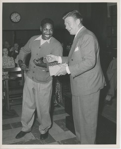 Arthur Godfrey handing prize to client at Institute Day