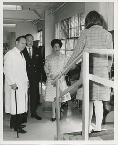 Bob Hope and unidentified woman observing patient