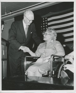 Bruce Barton shaking hands with client at graduation exercises