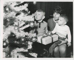 Mrs. Ronnie Joan Gabel and children admiring Christmas tree