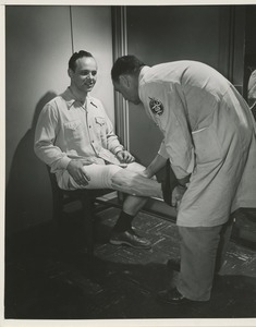 A technician fits a prosthetic leg for a patient