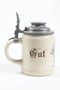 A mettlach stein with the "4F" logo within a wreath