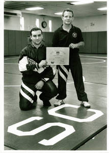 Daryl Arroyo and Dan Transue holding All-American award (1993-1994)