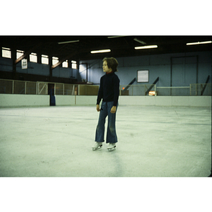 Child on ice skating rink