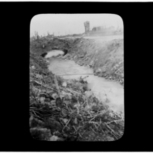 River and bridge next to a roadside