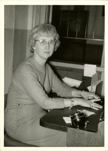 Kay Holland, Suffolk University's switchboard operator, seated at desk