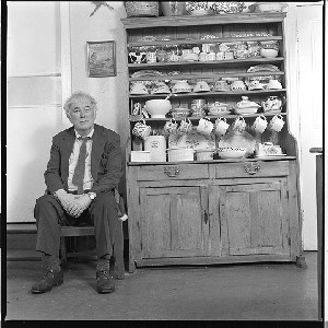 Seamus Heaney in the kitchen of his Dublin home. Taken at the kitchen table and at the dresser
