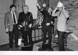 Two unidentified men, Fire Commissioner Leo D. Stapleton and Mayor Raymond L. Flynn