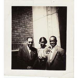 Woman poses with Reverend Dr. Wm. Frederick Fisher and Laymon Hunter