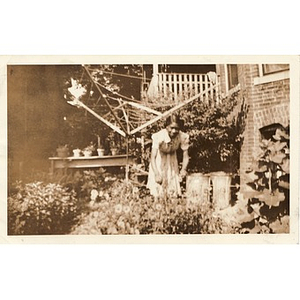 Inez Irving Hunter works in her garden