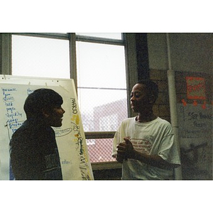 Two boys participating in a Teen and Kid Empowerment Program class.