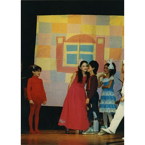 Children in an Areyto program performing in a play on stage at the Jorge Hernandez Cultural Center.