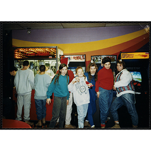 Five girls stand in front of the video arcade machines at a Tri-Club trip to Roller World