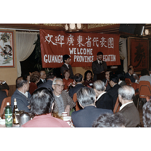 Man speaks at a welcome gathering for the Guangdong Province delegation at Imperial Tea House restaurant in Boston's Chinatown
