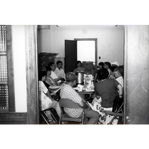 CPA members talking at a Workers' Center meeting