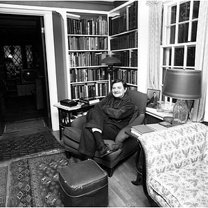 Rudolph Morris, Class of 1932, poses in his home library