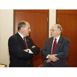 College of Business Administration Distinguished Service Award recipient Robert DiCenso (CBA '62), left, conversing with an unidentified man after the award ceremony