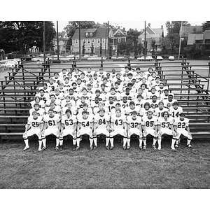 Group photo of the 1978 football team sitting on bleachers