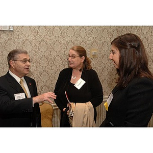 Eugene M. Reppucci Jr., left, Diana Marini and Marla Marini, right, at Alumni Ball and Alumni Awards Ceremony