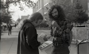 Free Spirit Press crew member distributing copies of the magazine, possibly in Springfield