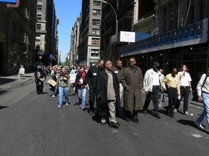 Jesse Jackson and Al Sharpton (center) at the head of a group protesters marching down East 17th Street