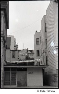 View of a building hung with a banner reading 'Revival -- April 28-May 5'