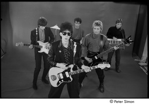 The Cars filming 'You Might Think': (l-r) Elliot Easton, Ric Ocasek, David Robinson, Benjamin Orr, and Greg Hawkes performing in front of a green screen