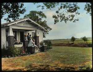 Oklahoma bungalow (white home beside large field, family on front stoop)